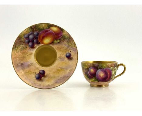 A Moseley and Freeman for Royal Worcester, a fruit painted cup and saucer, circa 1953, decorated with peaches and grapes on a