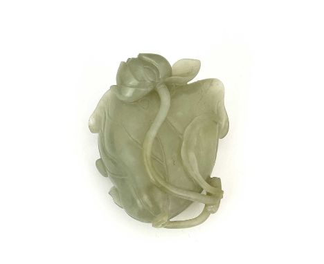 A pale jade 'lotus' cup, 18th century, deeply carved and hollowed as a single lotus leaf with everted frilly edge the two ste