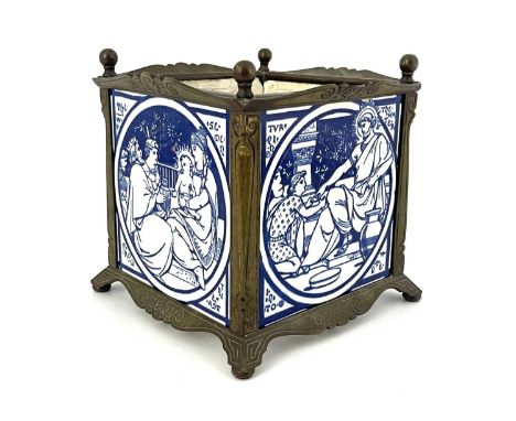John Moyr Smith for Minton, a Bible series tile jardiniere, circa 1885, brass cuboid form stand set with four blue transfer p