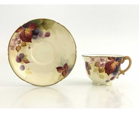 Kitty Blake for Royal Worcester, a handpainted tea cup and saucer, circa 1934, decorated with autumn leaves and blackberries 