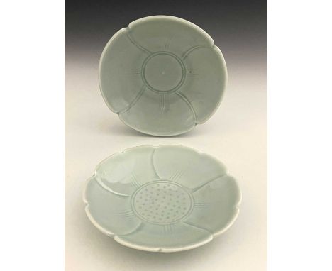 Derek Emms (British, 1929-2004), two fluted incised porcelain dishes, decorated with a light green celadon glaze, maker's mar