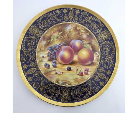D Fuller for Royal Worcester, a large fruit painted platter, decorated with peaches, raspberries and grapes, within a gilt fo