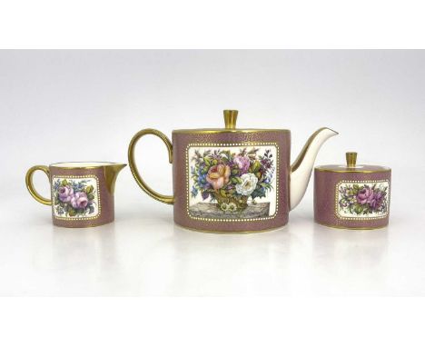 Stefan Nowacki for Lynton, a handpainted three piece tea set, cylindrical form,  the teapot decorated with a stil life study 