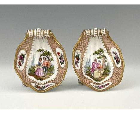 A pair of 19th Century Meissen style shell-shaped condiments, painted Watteau style scenes of courting couples on a pink fish