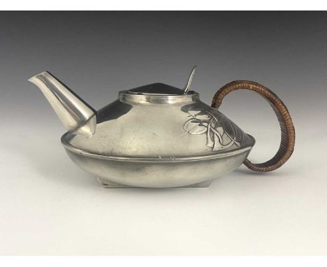Archibald Knox for Liberty and Co., a Tudric Arts and Crafts pewter teapot, model 023, squat ovoid form with stylised knotted