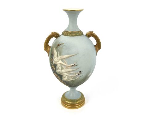 C Johnson for Royal Worcester, a Swan painted vase, circa 1903, twin handled pedestal urn form, decorated with swans in fligh