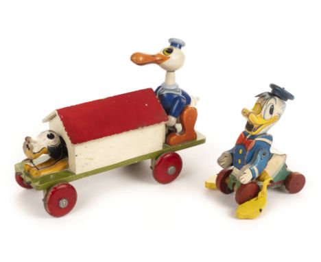 *[Disney, Walt]. Donald Duck and Pluto Rail Car toy, circa 1930s,  brightly painted wooden pull-along toy, Donald Duck and Pl