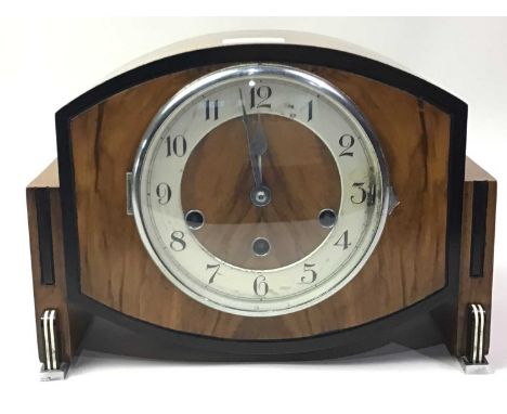 WALNUT CASED MANTEL CLOCK, the circular dial with Arabic numerals and eight day movement22cm high