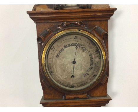 VICTORIAN BAROMETER/THERMOMETER, in carved oak103cm high