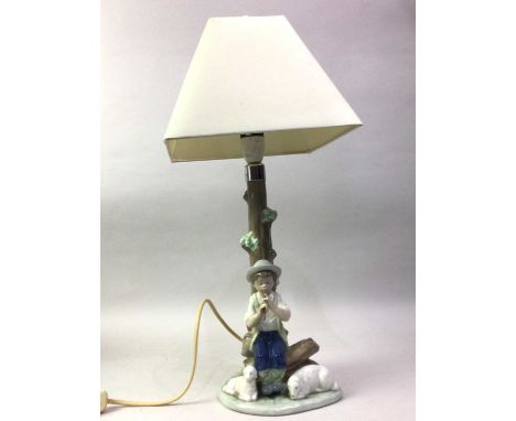 THREE NAO FIGURAL TABLE LAMPS, including one modelled as a boy playing a flute, each with shades tallest 53cm high overallQty