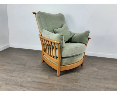 ERCOL RENAISSANCE ARMCHAIR, with green upholstered cushionsBack cushion zip has separated (photo added), some discolouration 