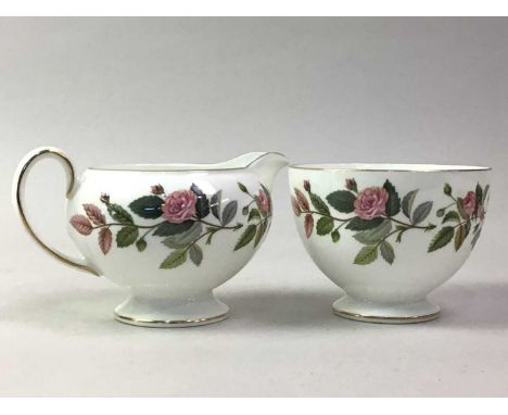 WEDGWOOD TEA SERVICE, HATHAWAY ROSE PATTERN comprising twelve cups and saucers, twelve side plates, sugar and cream and two t