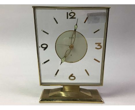 SWIZA GILT METAL CLOCK, set with Arabic and baton numerals, eight day movement18cm highSmall loss to the 'dot' above the bato