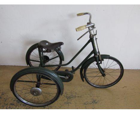 A child's vintage Hopper tricycle in racing green, with Brooks leather saddle, second quarter 20th Century