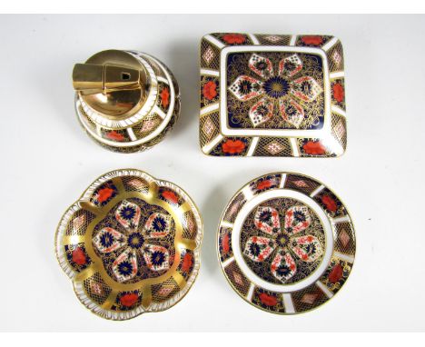 Four items of Royal Crown Derby Old Imari pattern bone china, including a covered trinket box, lighter and two pin dishes, No