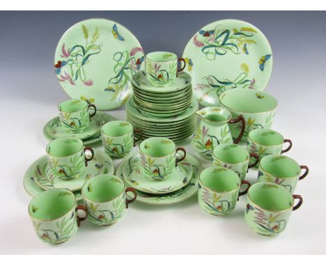 A George Jones and Sons porcelain tea service for twelve, comprising tea cups, saucers and side plates together with two cake