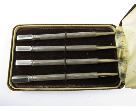 A cased set of sterling silver propelling Bridge pencils