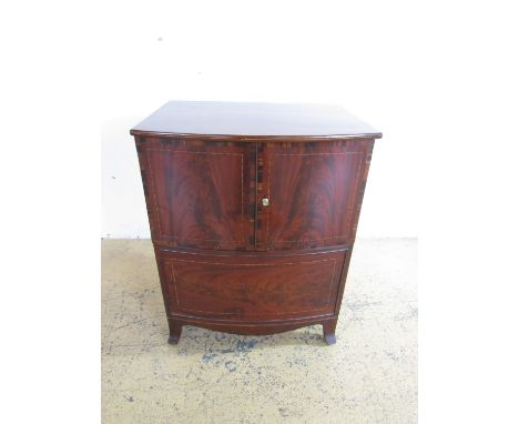 A George III string-inlaid and cross-banded mahogany bow-fronted chest commode