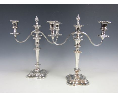 A pair of Barker-Ellis Georgian style two branch electroplate candelabra, each with detachable bobeche and central socket wit