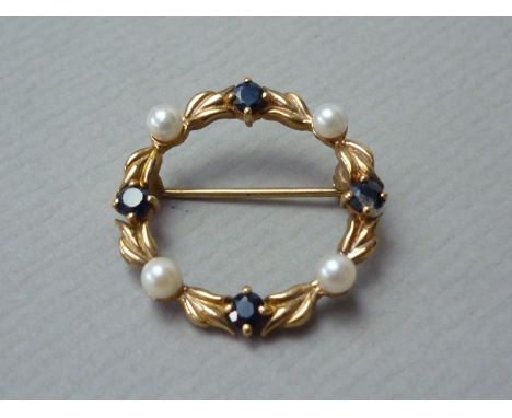 A pearl and sapphire wreath brooch, set on 9ct yellow gold 