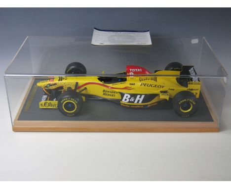 A cased Amalgam Models for Motorsport scale model of the Jordan 197 1997 Formula 1 racing car driven by Ralf Schumacher and G