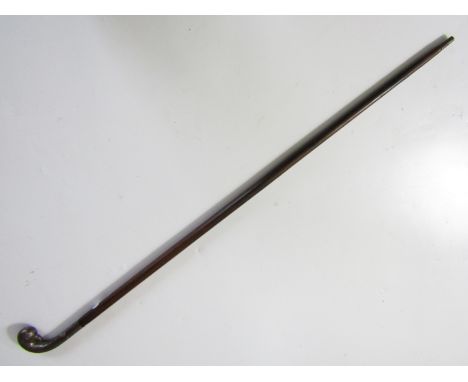 A late 19th / early 20th Century Anglo-Indian sword stick, having a steel pommel modelled as a stylized parrot's head, the ro