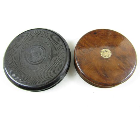 A 19th Century turned ebony snuff box together with a fruit wood example