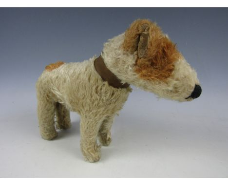 A 1920s Chad Valley Hygienic Toys dog, with rotating head and collar, 23 cm