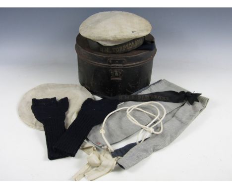 A First World War Royal Navy Ratings' cap bearing H M Torpedo Boat Tally, in  original cap tin with woolen mittens, lanyard, 