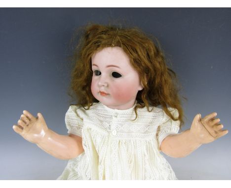 A Kammer & Rheinhardt character child doll Mein Liebling, with bisque socket head, feathered brows, painted eyelashes, closed