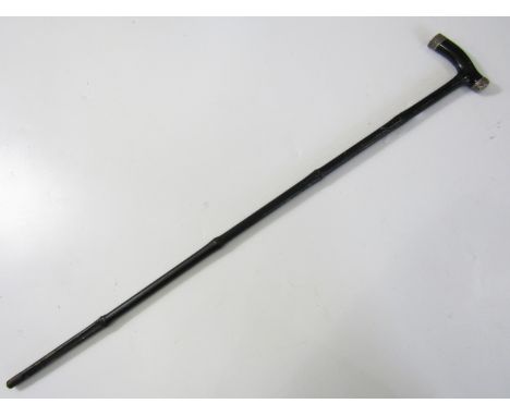 A late Victorian sword stick, in ebonized bamboo with white metal mounts, the blade of tapering square section, 89 cm, blade 