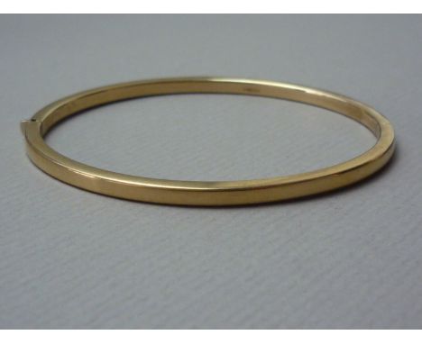 A 9ct gold slender hinged bangle, 4.8g