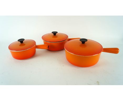 A set of three Cousances saucepans by Le Creuset, in burnt orange enamel