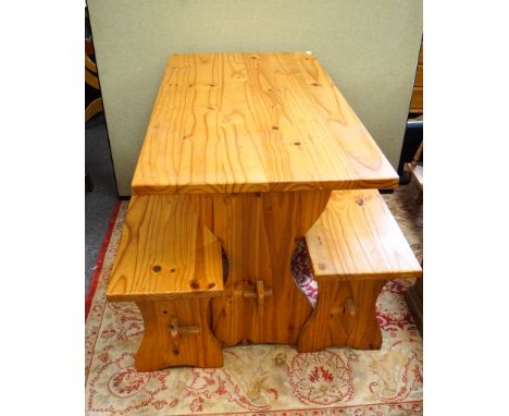 A pine table and two bench seats