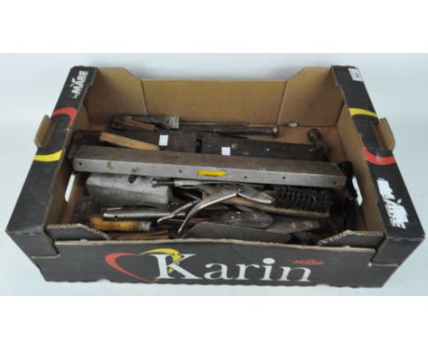 A large G-clamp and a box of tools