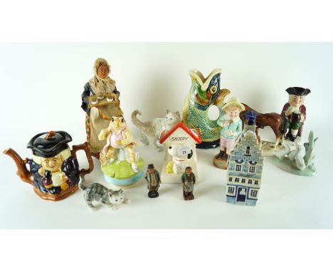 A collection of ceramic figure animals to include a Nao cat, Holland Delft decanter and more