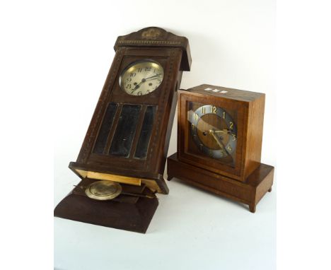 A Deco wood wall clock and a similar mantel clock