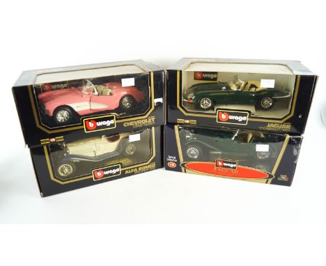 A collection of four 1:18 scale die cast model cars