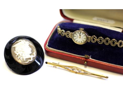 A 9ct yellow gold Rotary wristwatch, a seed pearl and diamond set bar brooch and a cameo brooch (3) 