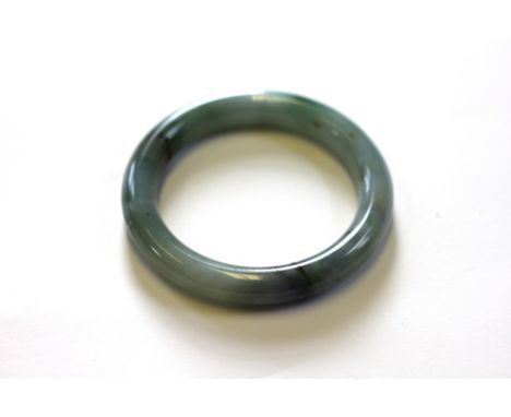 A plain polished jade bangle, 3"/7.5cm diameter