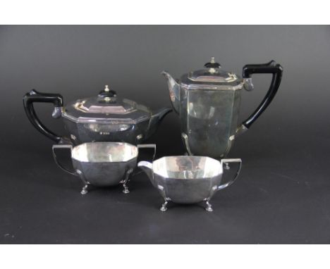 A silver four piece tea service, Francis Howard Ltd, Sheffield 1973, each piece of canted rectangular form and raised on four