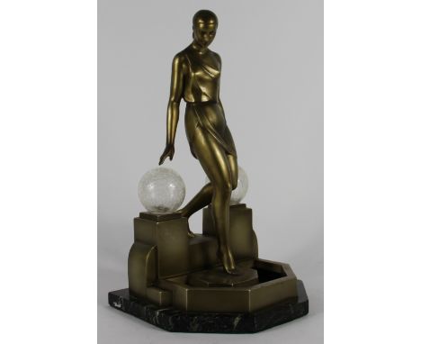 An Art Deco bronzed spelter figural lamp in the manner of Max Le Verrier, designed as a diaphonously clad female on stepped b