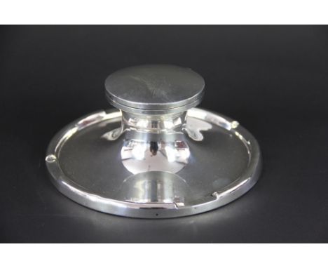 A large silver capstan inkwell, with sectional rim, A & J Zimmerman, Birmingham, 1916, 19cm diameter