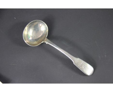 A George IV silver fiddle pattern sauce ladle, John Harris V, London 1833, engraved crest to the terminal, 18.4cm long
