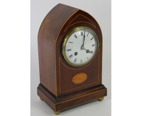 An Edwardian inlaid mahogany lancet clock, with enamelled Roman numeral dial and movement striking on a gong, 29.5cm