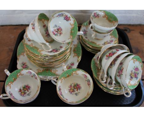 An Aynsley bone china part coffee set, decorated with flowers and green scale reserves; a similar Pragon tea set and a Royal 