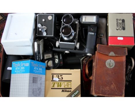 A Mamiya C series camera, with two Sekor 18cm lens; a Kodak 2A folding brownie; a Russian Halina camera; a Hoya 750205mm lens