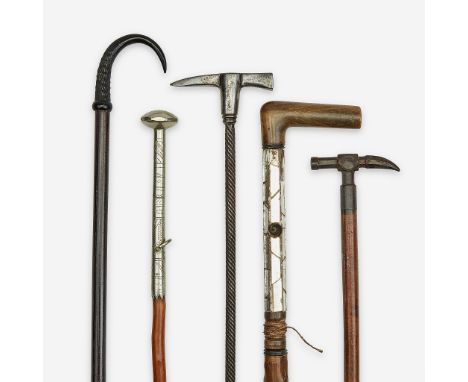 A group of five walking sticks pertaining to hiking Various dates 19th/20th century Comprising a Basque white metal and medla