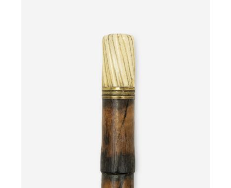 Mid 19th century The turned handle releasing to an engraved percussion gun, the release button unsheathing a 4 3/4-inch dagge