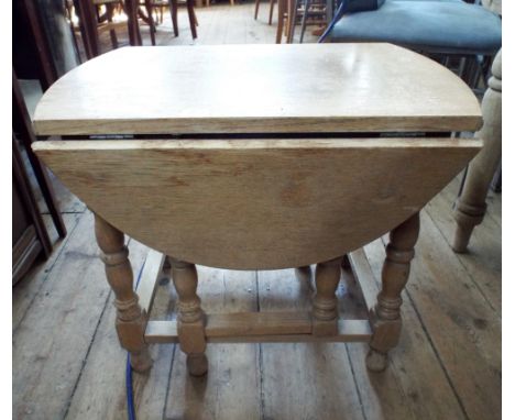 A light oak gate leg style coffee table approx 2' wide 